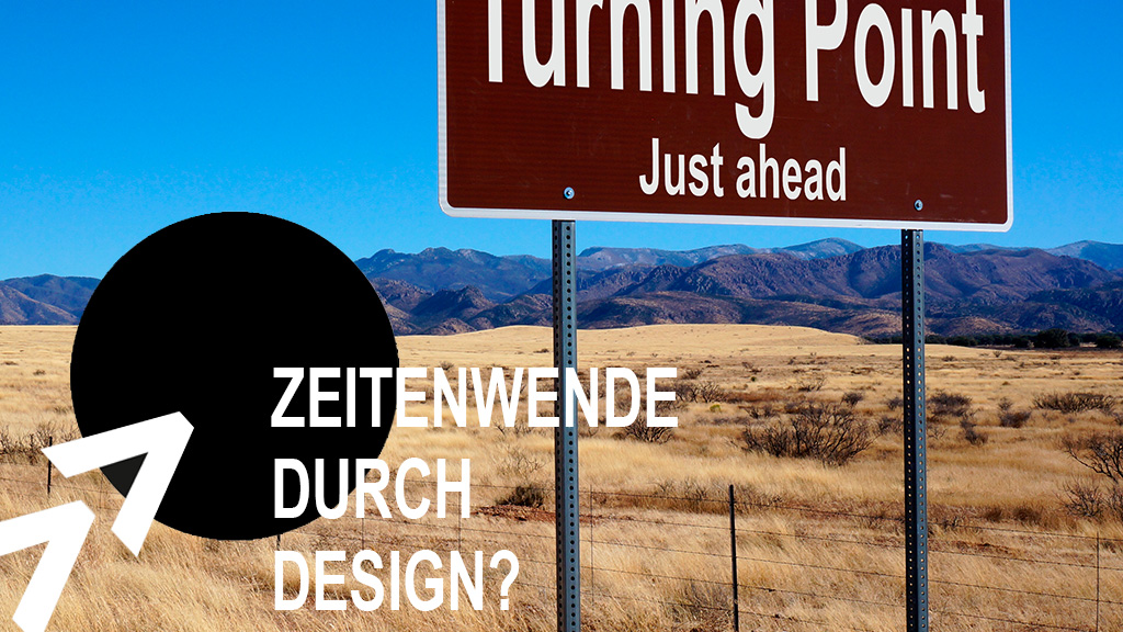 Verkehrsschild "Turning Point just ahead", im HIntergrund Steppe, Berge und blauer Himmel, Schriftzug "Zeitenwende durch Design?"